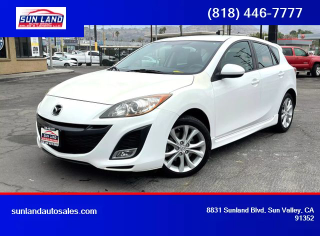 how much does a 2011 mazda 3 hatchback weight